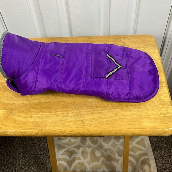Purple with grey lining dog jacket size small. Has 2 velcro straps. Pocket front - Picture 2 of 5